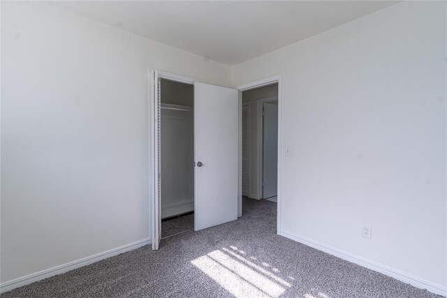 1524 Hampton Dr, Del City, OK 73115 - unfurnished bedroom with carpet floors, a closet, and baseboards