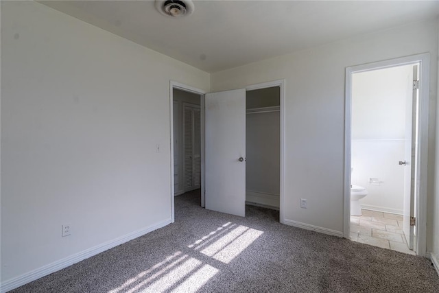 1524 Hampton Dr, Del City, OK 73115 - unfurnished bedroom featuring carpet, baseboards, connected bathroom, and a closet