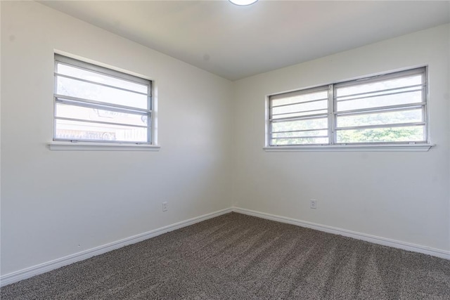 1524 Hampton Dr, Del City, OK 73115 - carpeted empty room featuring baseboards and healthy amount of natural light