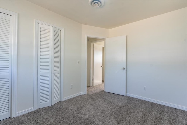 1524 Hampton Dr, Del City, OK 73115 - unfurnished bedroom featuring carpet flooring, baseboards, and a closet
