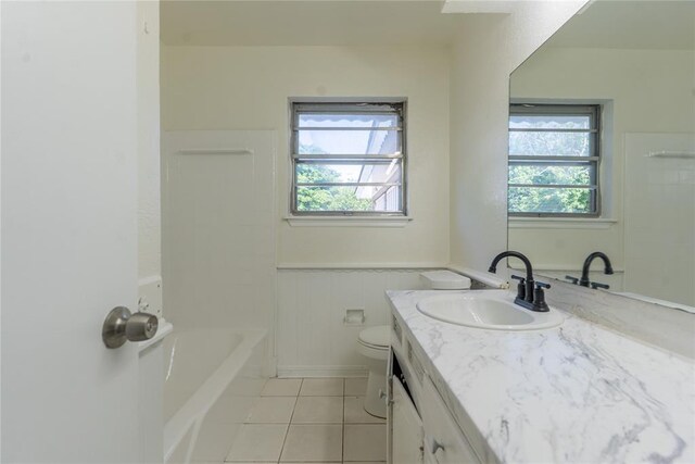 1524 Hampton Dr, Del City, OK 73115 - bathroom featuring tile patterned floors, vanity, toilet, and a wainscoted wall
