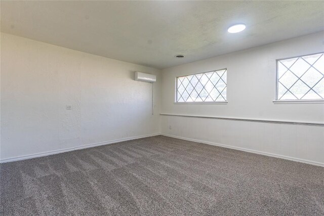 1524 Hampton Dr, Del City, OK 73115 - unfurnished room featuring carpet floors, a wall mounted AC, and plenty of natural light