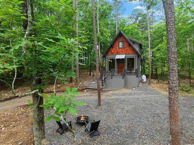 21 Sherwood Forest Ln, Broken Bow, OK 74728 - chalet / cabin featuring an outdoor fire pit and covered porch