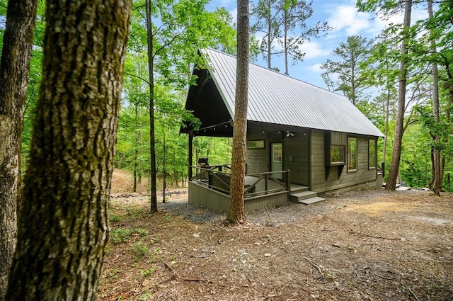 21 Sherwood Forest Ln, Broken Bow, OK 74728 - view of side of home with metal roof