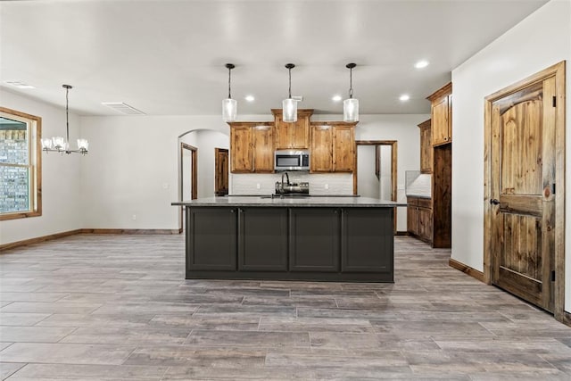 2414 Black Jack Way, Blanchard, OK 73010 - kitchen with stainless steel appliances, recessed lighting, tasteful backsplash, baseboards, and light wood finished floors