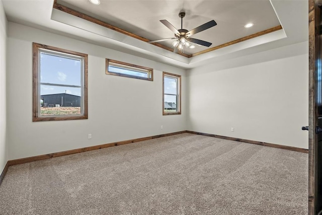 2414 Black Jack Way, Blanchard, OK 73010 - unfurnished room featuring a raised ceiling, baseboards, carpet, ceiling fan, and recessed lighting