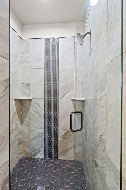 2414 Black Jack Way, Blanchard, OK 73010 - bathroom featuring a shower stall