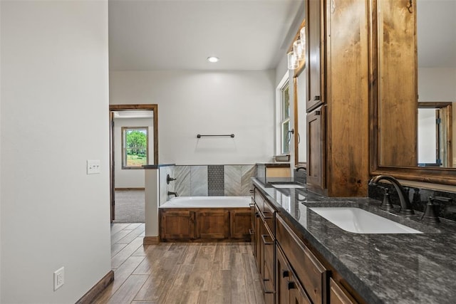 2414 Black Jack Way, Blanchard, OK 73010 - full bath featuring double vanity, wood finished floors, a garden tub, and recessed lighting