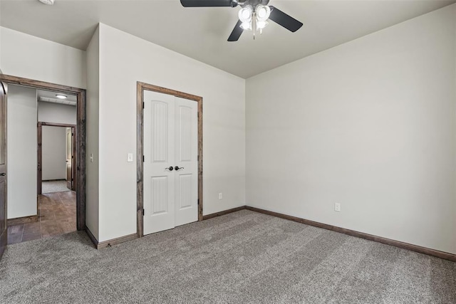 2414 Black Jack Way, Blanchard, OK 73010 - unfurnished bedroom featuring carpet, baseboards, a closet, and a ceiling fan