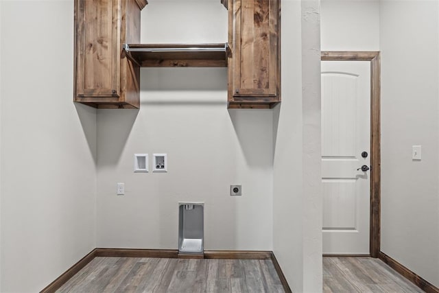 2414 Black Jack Way, Blanchard, OK 73010 - laundry room featuring electric dryer hookup, wood finished floors, hookup for a washing machine, baseboards, and cabinet space