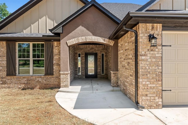 2414 Black Jack Way, Blanchard, OK 73010 - property entrance featuring board and batten siding, brick siding, and a garage