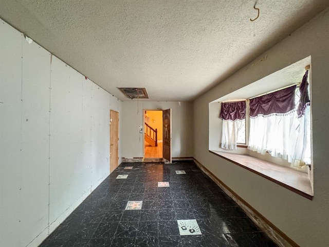 2010 Saddleback Blvd, Norman, OK 73072 - empty room with a textured ceiling and dark flooring