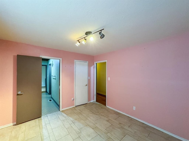 2010 Saddleback Blvd, Norman, OK 73072 - spare room featuring baseboards