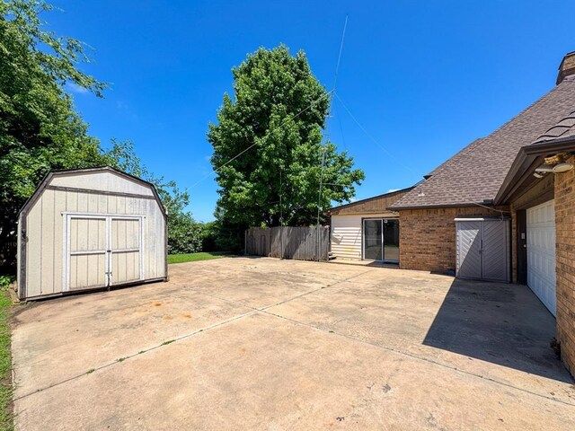 2010 Saddleback Blvd, Norman, OK 73072 - view of patio with a storage shed