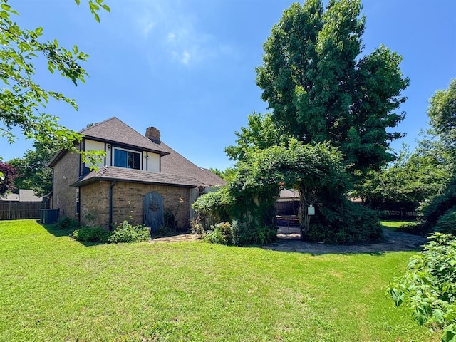 2010 Saddleback Blvd, Norman, OK 73072 - view of side of home featuring a chimney and brick siding
