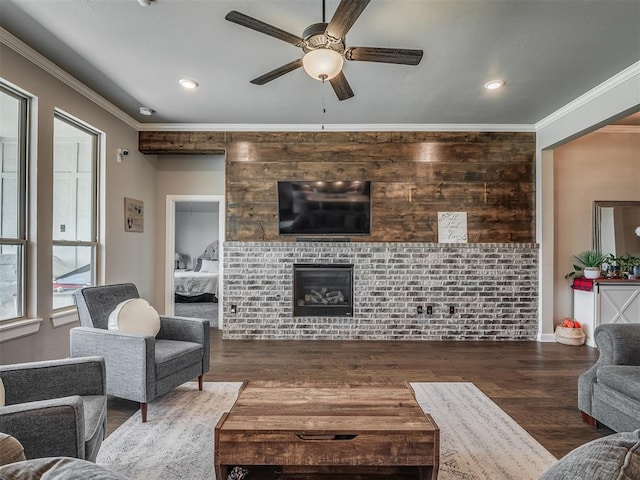 16112 Buffalo Dr, Oklahoma City, OK 73170 - living room featuring a ceiling fan, a tile fireplace, wood finished floors, ornamental molding, and recessed lighting