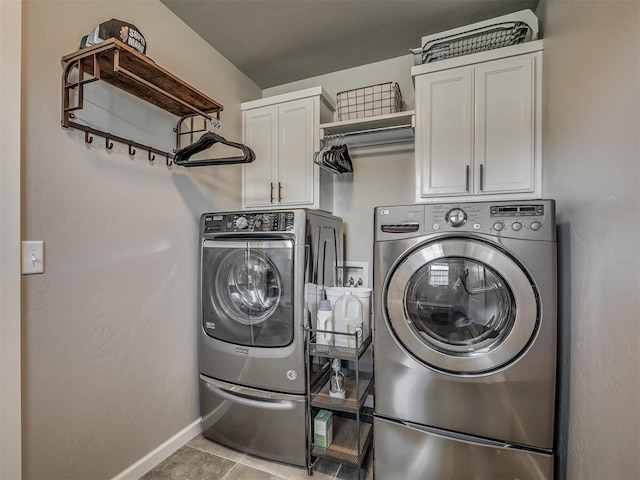 16112 Buffalo Dr, Oklahoma City, OK 73170 - laundry area with washing machine and clothes dryer, cabinet space, baseboards, and tile patterned floors