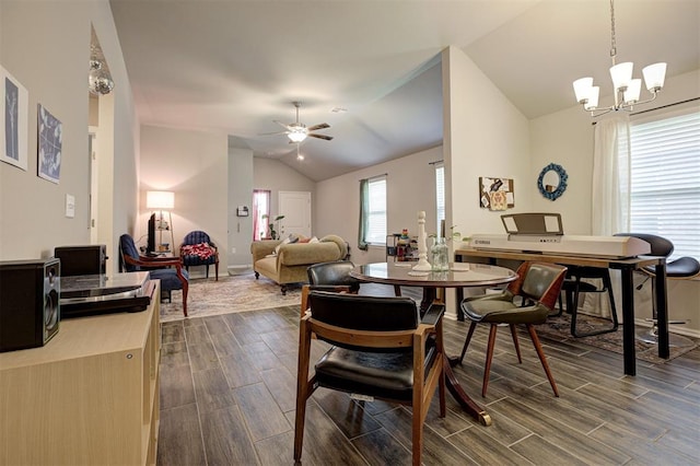 1301 Harvest Trl, Yukon, OK 73099 - dining area featuring lofted ceiling, wood tiled floors, ceiling fan, a chandelier, and baseboards
