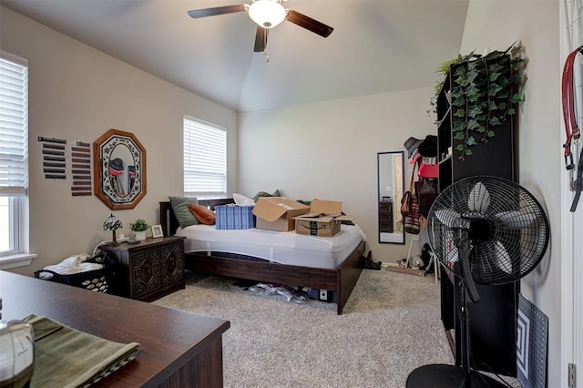 1301 Harvest Trl, Yukon, OK 73099 - bedroom featuring light colored carpet, multiple windows, lofted ceiling, and a ceiling fan