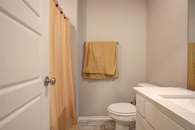 1301 Harvest Trl, Yukon, OK 73099 - bathroom featuring vanity, toilet, and baseboards