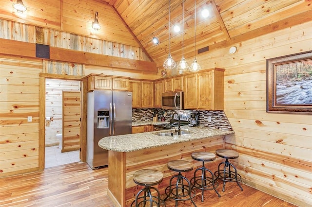 26 Huckleberry Trl, Broken Bow, OK 74728 - kitchen featuring stainless steel appliances, wooden ceiling, vaulted ceiling, a peninsula, and light stone countertops
