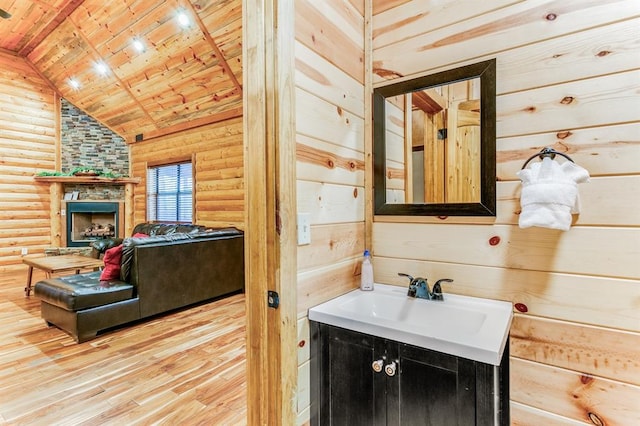 26 Huckleberry Trl, Broken Bow, OK 74728 - bathroom featuring wood ceiling, log walls, wood finished floors, vanity, and vaulted ceiling