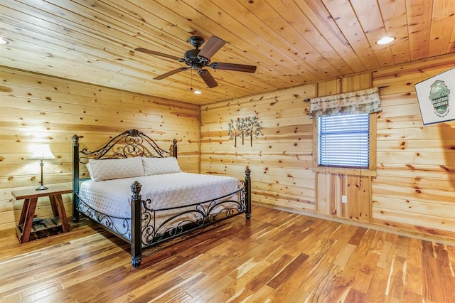 26 Huckleberry Trl, Broken Bow, OK 74728 - bedroom featuring wood ceiling, wood walls, light wood-style floors, recessed lighting, and ceiling fan
