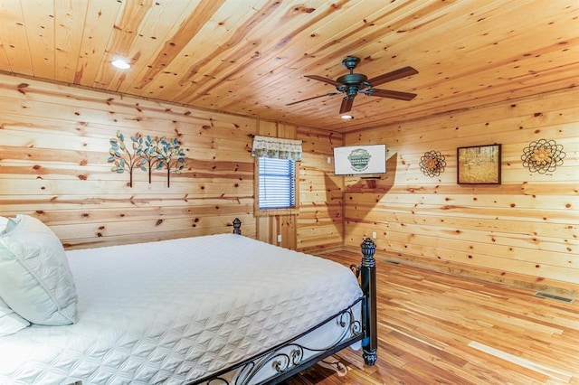 26 Huckleberry Trl, Broken Bow, OK 74728 - bedroom with wooden ceiling, wood walls, and wood finished floors