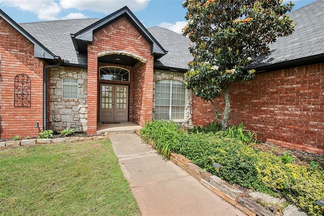 1329 S Southersby Dr, Mustang, OK 73064 - view of exterior entry with french doors and brick siding
