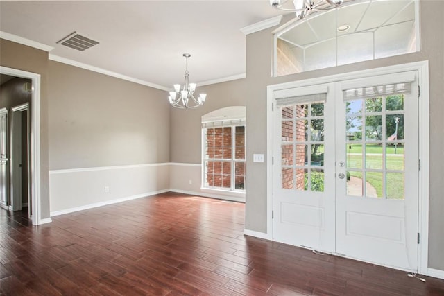1329 S Southersby Dr, Mustang, OK 73064 - foyer featuring a chandelier, ornamental molding, baseboards, dark wood-type flooring, and french doors