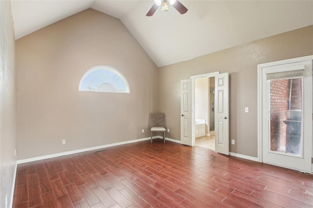 1329 S Southersby Dr, Mustang, OK 73064 - unfurnished room featuring ceiling fan, wood finished floors, lofted ceiling, and baseboards