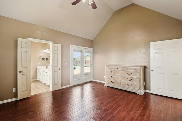 1329 S Southersby Dr, Mustang, OK 73064 - unfurnished bedroom with access to outside, dark wood-style floors, high vaulted ceiling, baseboards, and ensuite bath