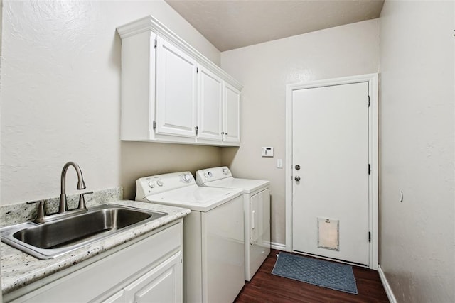 1329 S Southersby Dr, Mustang, OK 73064 - laundry room with separate washer and dryer, dark wood-style floors, cabinet space, and baseboards