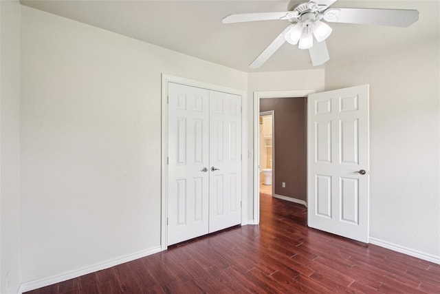1329 S Southersby Dr, Mustang, OK 73064 - unfurnished bedroom with wood finished floors, baseboards, a closet, and a ceiling fan