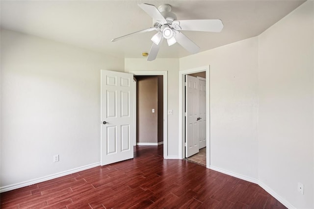 1329 S Southersby Dr, Mustang, OK 73064 - unfurnished bedroom featuring wood finished floors, baseboards, and a ceiling fan