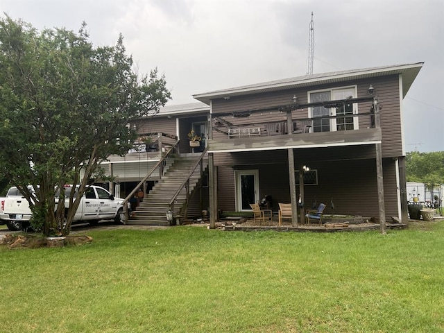 68 Ridgeview Rd, Ardmore, OK 73401 - back of house featuring stairway and a lawn