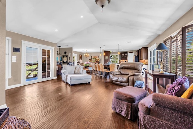 68 Ridgeview Rd, Ardmore, OK 73401 - living area with lofted ceiling, dark wood-style flooring, recessed lighting, a chandelier, and french doors