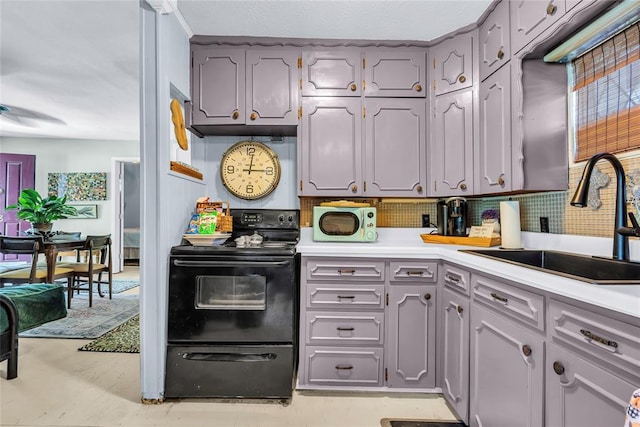 68 Ridgeview Rd, Ardmore, OK 73401 - kitchen featuring black electric range oven, a sink, light countertops, backsplash, and gray cabinets
