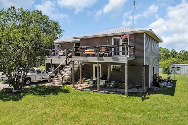 68 Ridgeview Rd, Ardmore, OK 73401 - back of house with stairs, a yard, a deck, and a patio area