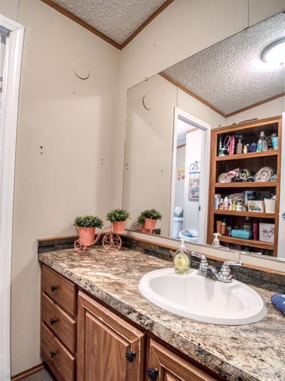 15026 N County Road 3370th Rd, Stratford, OK 74872 - bathroom with ornamental molding, a textured ceiling, and vanity