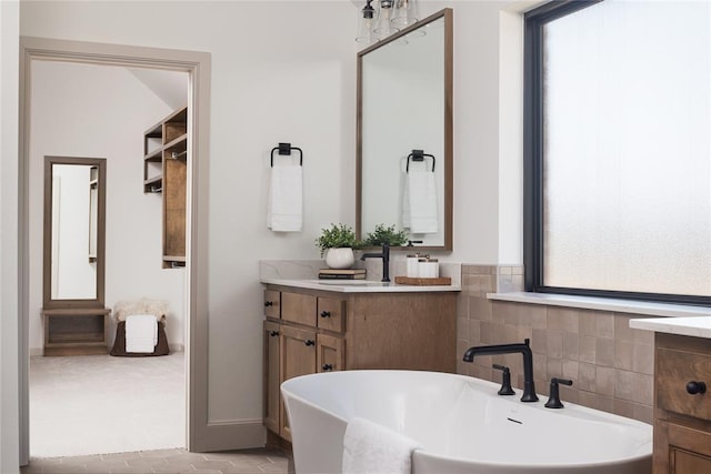 9117 SW 90th St, Mustang, OK 73064 - bathroom with plenty of natural light, vanity, and a soaking tub