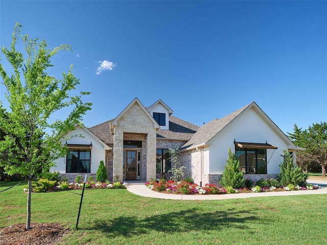 9117 SW 90th St, Mustang, OK 73064 - modern home featuring stone siding, a front lawn, and stucco siding