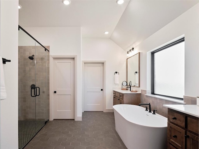 9117 SW 90th St, Mustang, OK 73064 - full bath with a stall shower, lofted ceiling, vanity, a freestanding tub, and recessed lighting