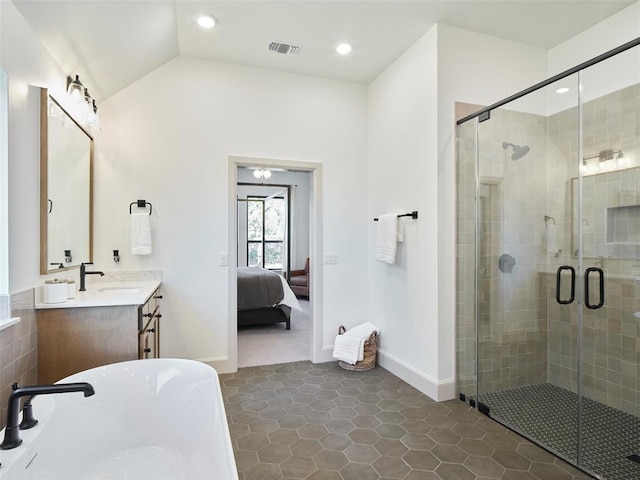 9117 SW 90th St, Mustang, OK 73064 - ensuite bathroom featuring a freestanding bath, vanity, a stall shower, tile patterned floors, and baseboards