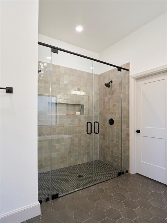 9117 SW 90th St, Mustang, OK 73064 - bathroom with a shower stall, tile patterned floors, and recessed lighting