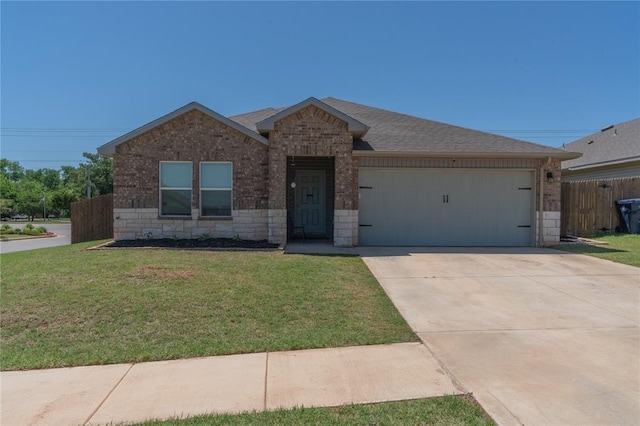 3429 Molly Dr, Yukon, OK 73099 - ranch-style house with brick siding, an attached garage, concrete driveway, roof with shingles, and stone siding
