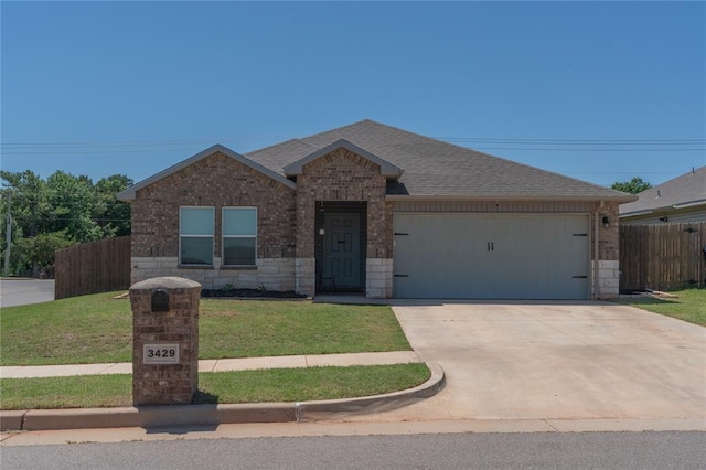 3429 Molly Dr, Yukon, OK 73099 - ranch-style home featuring an attached garage, a shingled roof, brick siding, and driveway