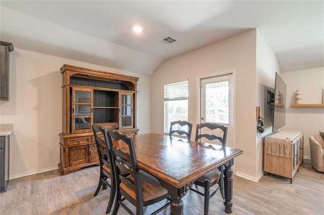 3429 Molly Dr, Yukon, OK 73099 - dining space with lofted ceiling, light wood-style flooring, and baseboards