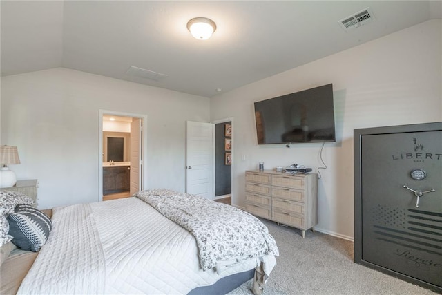 3429 Molly Dr, Yukon, OK 73099 - bedroom featuring lofted ceiling, light colored carpet, connected bathroom, and baseboards