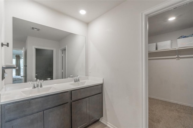 3429 Molly Dr, Yukon, OK 73099 - bathroom with double vanity, baseboards, and recessed lighting